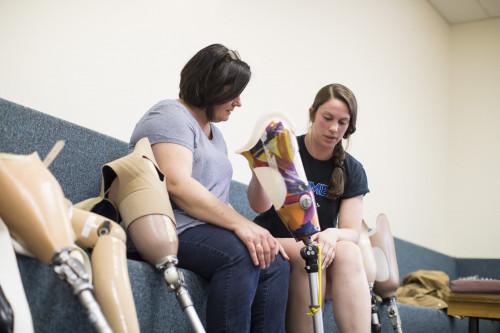 Physical therapy student with prosthetic leg